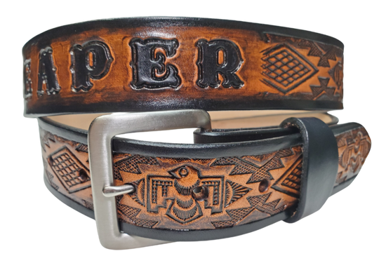 The Holliday features a cool Southwestern embossing on its full-grain American veg-tanned cowhide, about 1/8" thick and 1 1/2" wide. It sports a solid brass buckle with an antique nickel finish, available in 3 hand-finished colors and smooth, burnished painted edges. You can personalize it with your name or let the design run wild across the whole belt. Crafted with care in our Smyrna, TN workshop just outside Nashville.