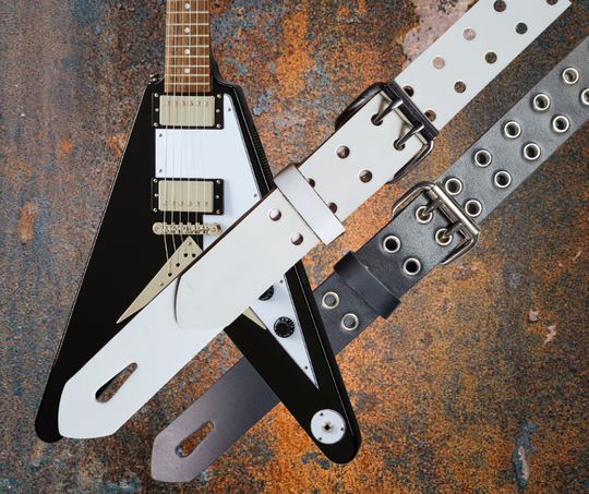Great Musicians have been a staple for years in Nashville. Be on your way starting your journey with this Vintage styled 1 1/2" HOLES Strap. The main Body of the Guitar strap is approx. 1/8" thick with Holes down the entire Strap. The Buckle and End hole adjustment goes from approx. 42" to 56" at it's longest . Made just outside Nashville in our Smyrna, TN. shop. It will will be your favorite strap after a "break in" period.