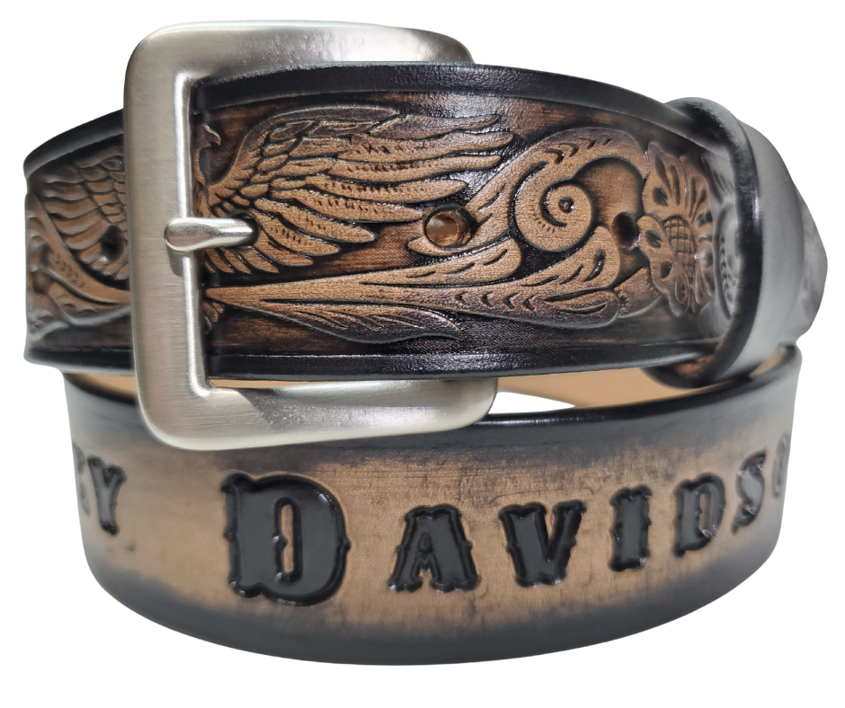 This Name Belt features a single strip of vegetable tanned leather in a patriotic pattern, highlighted by a flying eagle. The antique nickel-finished solid brass buckle is easily replaceable, allowing you to customize the design with your own buckle. It's crafted in our Smyrna, Tennessee shop, near Nashville.