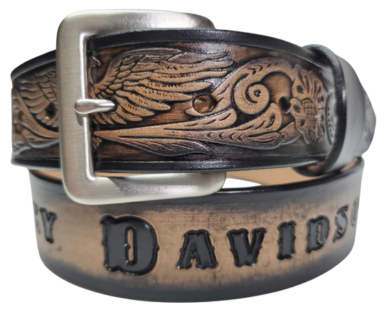 This Name Belt features a single strip of vegetable tanned leather in a patriotic pattern, highlighted by a flying eagle. The antique nickel-finished solid brass buckle is easily replaceable, allowing you to customize the design with your own buckle. It's crafted in our Smyrna, Tennessee shop, near Nashville.