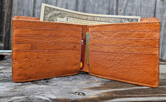If you appreciate craftmanship this USA Made Genuine Hornback Crocodile Bifold will do the trick. Genuine Ostrich Lining is complete with matching Leather Lining, 1 Bill Pocket, 8 Card Slots, 2 Inner Side Pockets. Each hide is unique, each wallet is unique! Handmade in USA and sold in our Smyrna, TN shop not far from the gulch downtown Nashville.

Thin profile