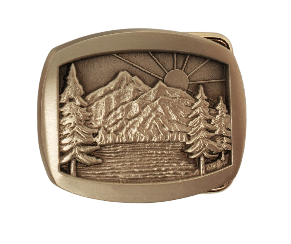 If you like narrow belts and buckles this antique Bronze belt buckle is perfect for you. Rectangle/Oval shaped with rounded corners, featuring Pine trees, Mountains, and a breathtaking Sunrise. Don't miss out on getting it online or in-store at our shop near Nashville in Smyrna, TN.