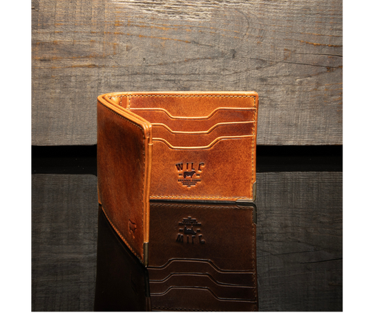 A traditional billfold with an internal antique brass money clip to secure cash. Includes three card slots and a mesh ID slot with an additional pocket underneath. Bottom right corners are reinforced by antique brass. Compact 4.25” x 1” x 3.5” made Certified Full Grain Italian Veg-Tan Leather, arguably the best in the world. Find yours at our Smyrna, TN close to Franklin. Made by Will Leather.