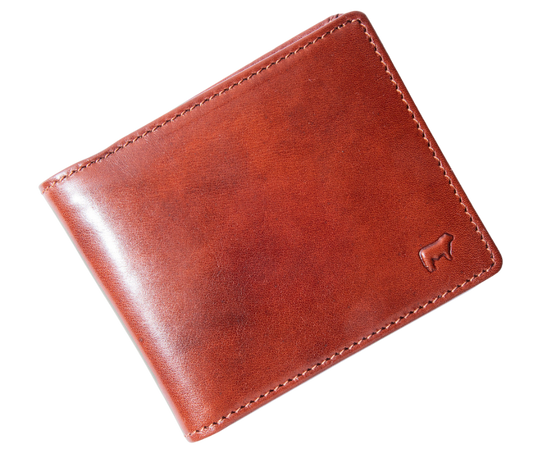 Italian Full Grain Veg-Tan is some of the finest leather in the world. Yes it cost more but when you want the best your willing to pay a bit more. Smooth and soft Italian calfskin with a glossy finish in Brandy and Cognac. 5 card slots, I.D. slot, 2 cash pockets. It's compact 3" x 4" x .75" size is right size for your daily needs. Now stocked at our Smyrna, TN store not far from Famous Franklin. Made by Will Leather, Imported.