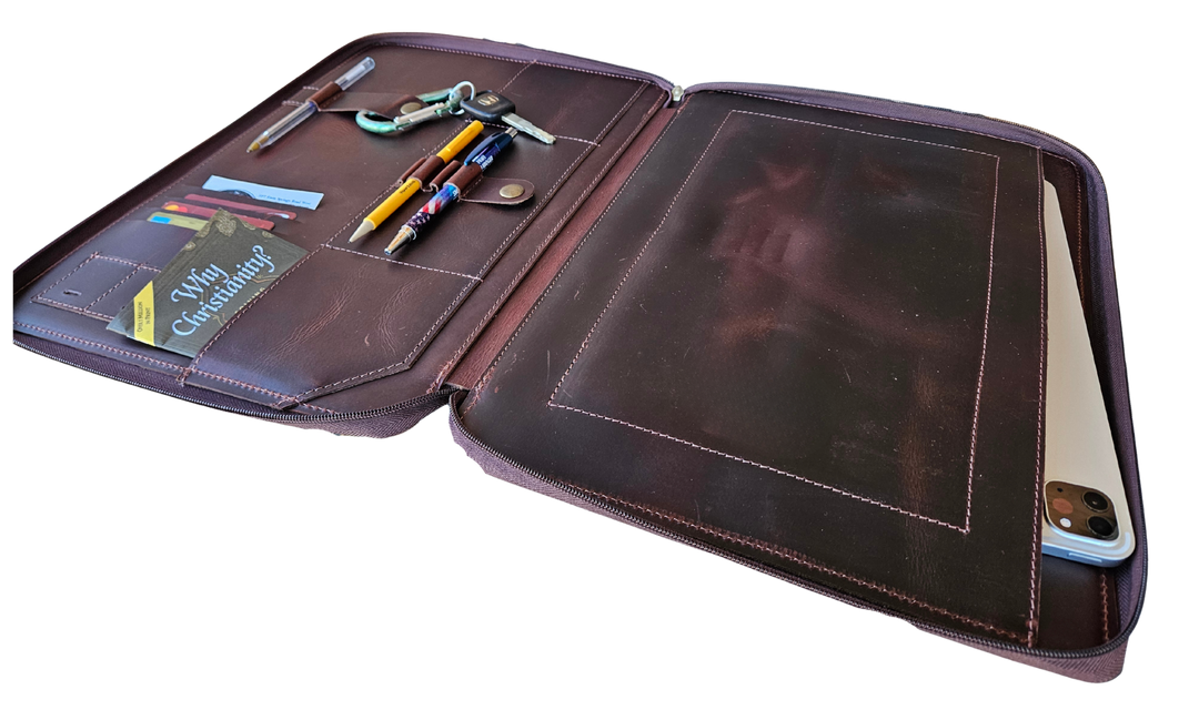 Stay organized with our Hudson Leather MacBook Portfolio. Being crafted from top-grain buffalo leather that develops character over time. Designed to fit a 13” MacBook or tablet, this portfolio features a dedicated laptop sleeve, phone sleeve, power bank slot, and five pen holders, ensuring all your essentials are neatly stored. Whether for work or on the go, this portfolio is a timeless blend of elegance and efficiency. Part of our Home and Office leathers at our Smyrna, TN shop.