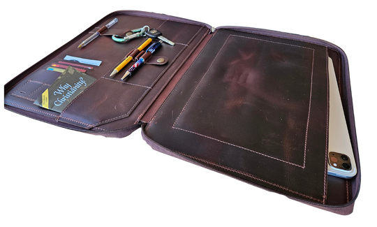 Stay organized with our Hudson Leather MacBook Portfolio. Being crafted from top-grain buffalo leather that develops character over time. Designed to fit a 13” MacBook or tablet, this portfolio features a dedicated laptop sleeve, phone sleeve, power bank slot, and five pen holders, ensuring all your essentials are neatly stored. Whether for work or on the go, this portfolio is a timeless blend of elegance and efficiency. Part of our Home and Office leathers at our Smyrna, TN shop.