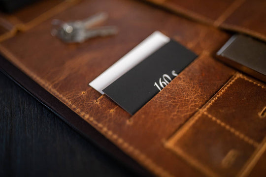 Stay organized with our Hudson Leather MacBook Portfolio. Being crafted from top-grain buffalo leather that develops character over time. Designed to fit a 13” MacBook or tablet, this portfolio features a dedicated laptop sleeve, phone sleeve, power bank slot, and five pen holders, ensuring all your essentials are neatly stored. Whether for work or on the go, this portfolio is a timeless blend of elegance and efficiency. Part of our Home and Office leathers at our Smyrna, TN shop.