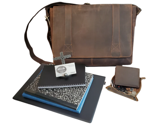The Intern Leather Messenger Bag is available at our Smyrna, TN shop not far from Nashville. It has a full flap that closes with 2 magnetic catches. The back has a zip &amp; pocket and a back strap to slide on a rolling suitcase. Attached to each side, a leather shoulder strap is &amp; reinforced with cotton webbing. Forward open pocket length of bag is held closed leather strip with magnetic catch. Main compartment zips closed, is lined with a sturdy fabric, has and &amp; inside zip pocket