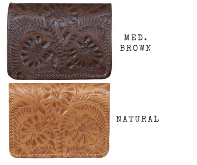 Indulge with this full grain leather tri-fold wallet! Every detail is hand-stained and hand-tooled in a western floral pattern, with a snap closure and a back zippered pocket for extra coins. Open it up to reveal 8 card slots, plus 3 other card-sized compartments, a clear ID slot, and two cash compartments. The pockets are lined with a light cotton linen to keep it slim. Swing by our Smyrna, TN shop (just off I24 from Nashville) to get yours today!