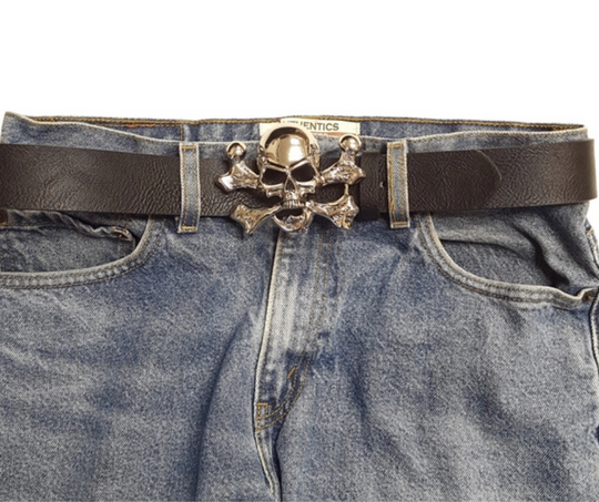 The "Jolly Roger" buckle features the iconic skull and crossbones design. It fits any standard 1 1/2" belt and shines with a polished silver finish. Measuring about 3" by 4", this bold buckle is ready to add some pirate flair. Grab yours online or visit us in Smyrna, TN, near Nashville.