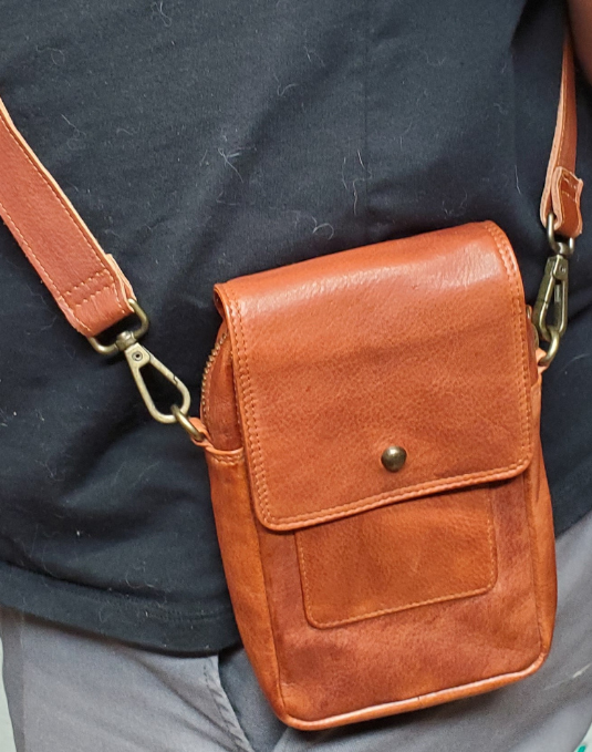 The Jackie Crossbody Purse is the perfect companion for carrying just the essentials - phone, driver's license, and debit card. With an adjustable strap, 2 external zippered pockets, and inner card slots, this bag is both functional and convenient. Available now at our store in Smyrna, TN! Choose from 3 colors.