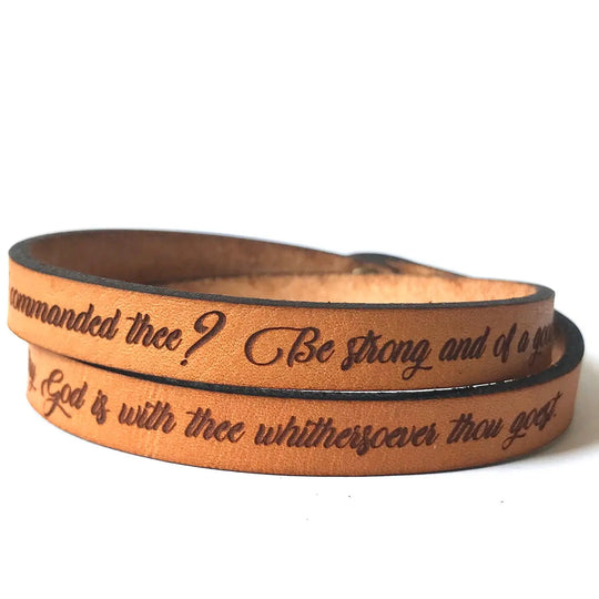 Inspiring Leather Bracelets Stocked at our Smyrna, TN shop. Joshua 1:9 Thin double wrapped leather bracelet made from quality full grain leather, laser engraved with: “Have not I commanded thee? Be Strong and of a good courage; be not afraid, neither be thou dismayed: for the Lord thy God is with thee whithersoever thou goest.” Stud adjustable length: 15 and 15 1/2 and 16 x 3/8 in