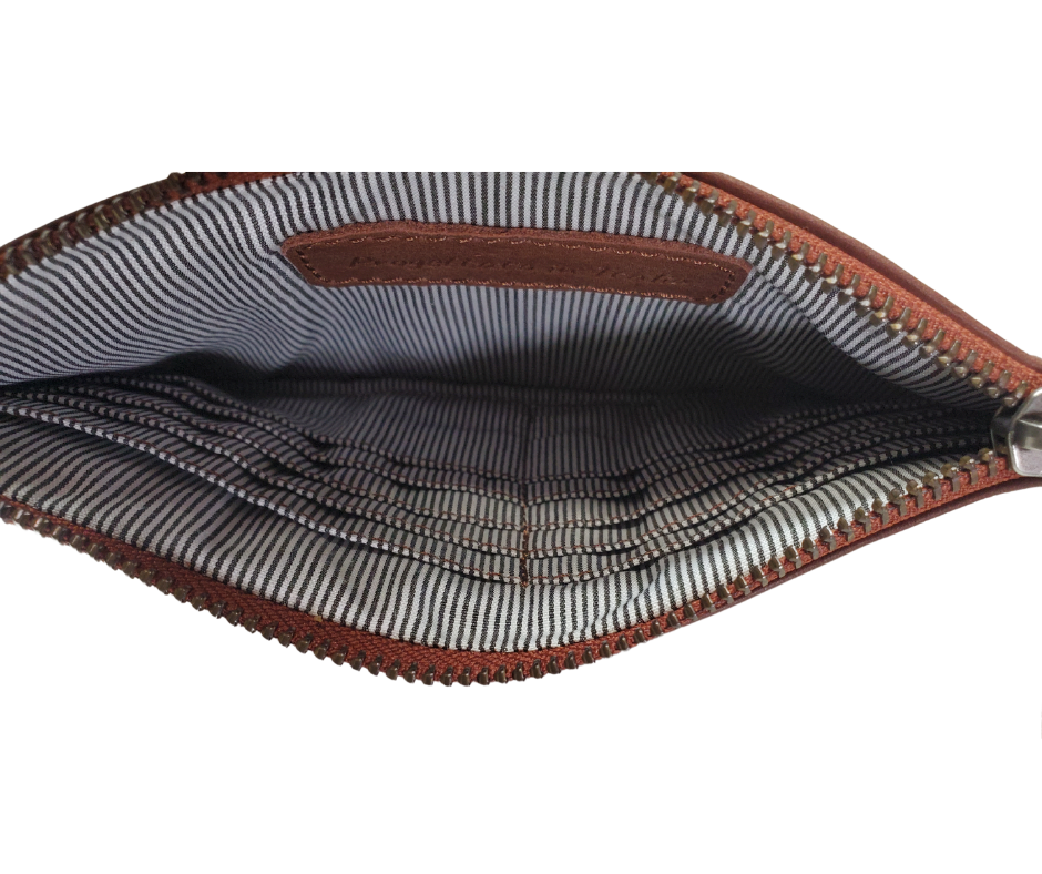 Our Kara wallet is a minimalist, sleek wristlet made from super soft Nappa leather. It can keep all your credit cards, cash, phone, and knick-knacks safely. Also works as a wristlet or keep it in your favorite bag when you have more stuff. Get yours at our world famous Smyrna, TN leather shop a short Uber ride from downtown Nashville.