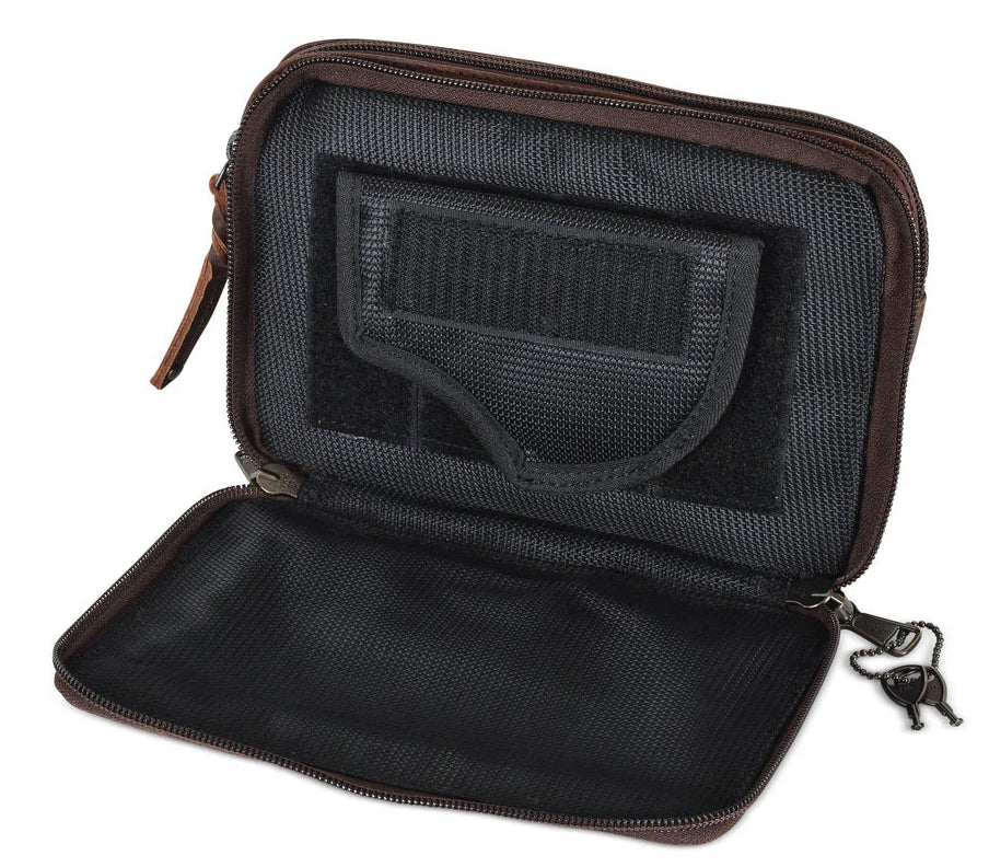 The Kailey Fanny/Sling Conceal Purse is crafted with genuine buffalo leather. This is just not your average fanny pack. The bag is highlighted with beautiful crisscross lacing or decorative studs. Unzip the front flap for easy access to your weapon. Additional storage is provided by a slip pocket on the back and a decorative zippered pocket on the front. Can be worn around the waist or as a sling. Part of our leather conceal handbags at our Smyrna, TN shop.