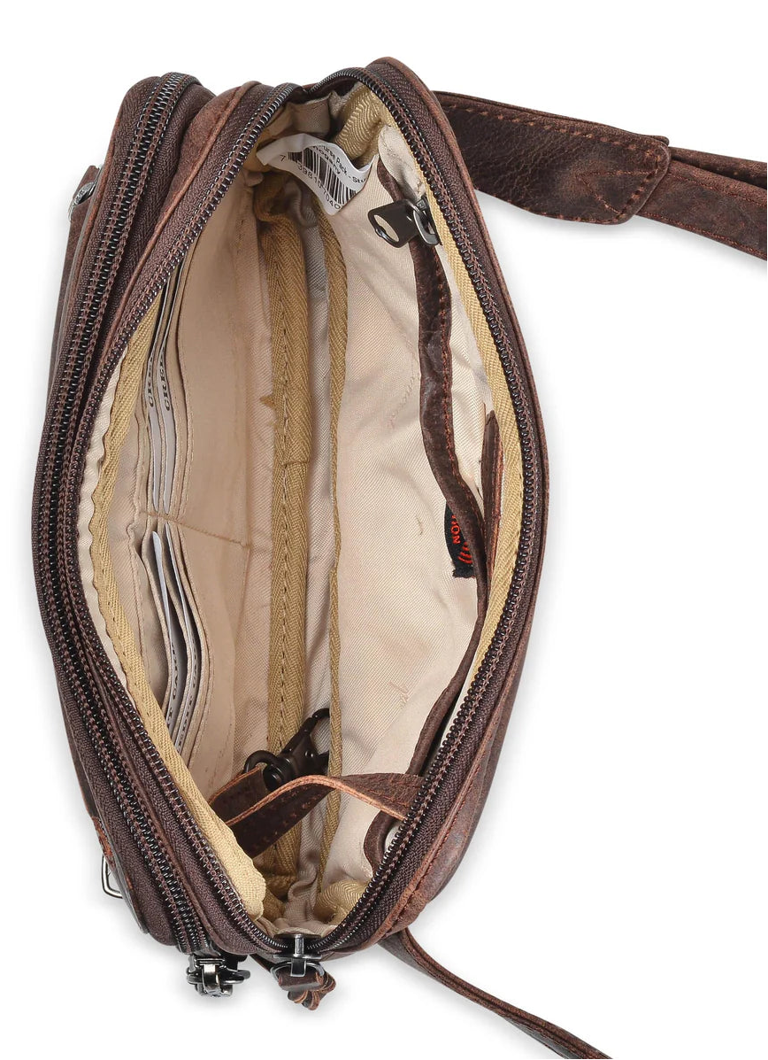 The Kailey Fanny/Sling Conceal Purse is crafted with genuine buffalo leather. This is just not your average fanny pack. The bag is highlighted with beautiful crisscross lacing or decorative studs. Unzip the front flap for easy access to your weapon. Additional storage is provided by a slip pocket on the back and a decorative zippered pocket on the front. Can be worn around the waist or as a sling. Part of our leather conceal handbags at our Smyrna, TN shop.