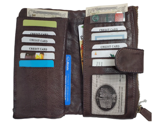 Our Katelyn Leather Long Clutch Wallet is a stylish way to tote your necessities. Soft to touch with plenty of space. Unsnap it and see 11 card slots, an I.D. slot, 2 underside cash pockets, also room for a checkbook, zippered pocket and a larger open pocket for important notes or receipts to keep everything secure. Stocked in Smyrna, TN and it&