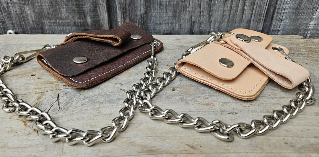 The Kickstand is for the Minimalist. The most compact chain wallet we offer. Just enough room for some folded up cash a couple cards. Nothing to bog you down. Made in USA!

Choose Natural Veg-tan, Oil Tan Brown or Black
2 pockets
Complete with 12" chain
Approximate size 4.5" x 2.75"
Snap Closure
Real Leather