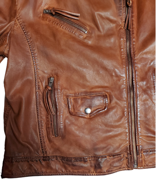 A Timeless Classic leather Modern moto Jacket in Vintage brown by Scully. Expertly tailored from Super soft, high quality leather. The sleek silhouette is slightly fitted at the waist to flatter. Your shape, while shoulder epaulettes and polished hardware add a classic motto finish. Get yours at our Smyrna, TN shop not far from crazy downtown Nashville.

Effortless attitude to any outfit.
Asymmetrical front zip closure, notch lapels with. Snap buttons
Multiple zippered and flap pockets