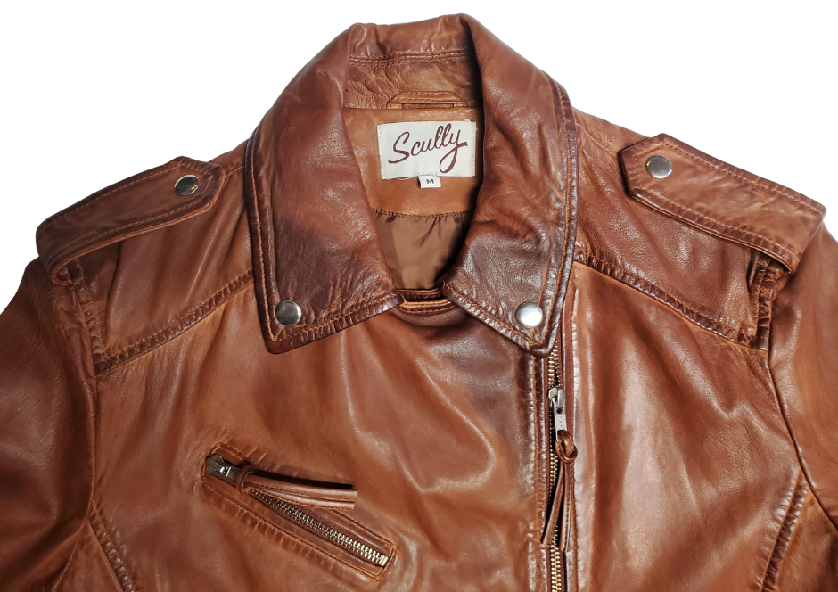 A Timeless Classic leather Modern moto Jacket in Vintage brown by Scully. Expertly tailored from Super soft, high quality leather. The sleek silhouette is slightly fitted at the waist to flatter. Your shape, while shoulder epaulettes and polished hardware add a classic motto finish. Get yours at our Smyrna, TN shop not far from crazy downtown Nashville.

Effortless attitude to any outfit.
Asymmetrical front zip closure, notch lapels with. Snap buttons
Multiple zippered and flap pockets