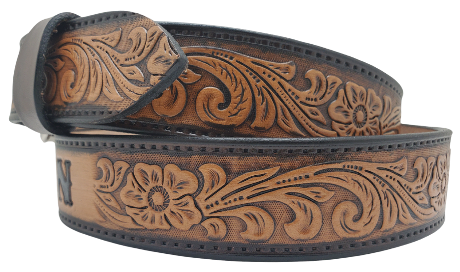 Unleash your western inner self with The "Lariat" Name Belt. Each belt features a unique hand-stained strip of vegetable tanned leather, adorned with a bold and timeless Western Floral pattern. The antique nickel finish solid brass buckle can be effortlessly swapped out. Crafted by hand at our Smyrna, Tennessee shop, just a stone's throw away from Nashville.