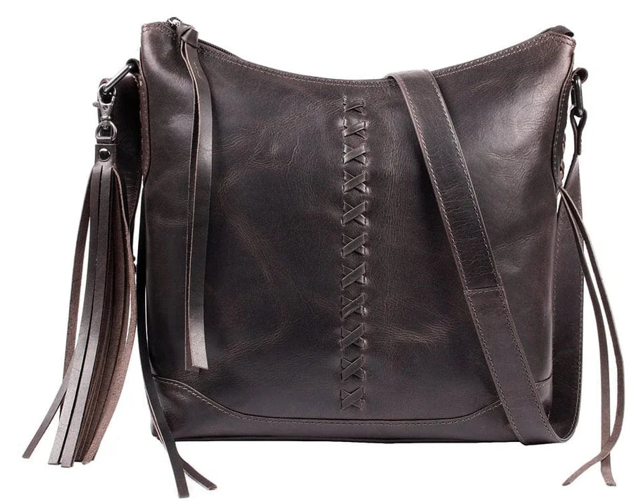 The Blake Scooped Leather Crossbody is crafted from premium full-grain leather, each piece showcasing its own natural variations in grain and shading. Intricate leather crisscross stitching adorns the front and sides, complemented by decorative long tassels for added charm. A large open pocket for your cell phone, and a leather key strap. A zippered pocket on the back adds more room for your essentials. Part of our Carry Conceal Handbags in our Smyrna, TN shop.