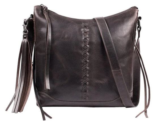 The Blake Scooped Leather Crossbody is crafted from premium full-grain leather, each piece showcasing its own natural variations in grain and shading. Intricate leather crisscross stitching adorns the front and sides, complemented by decorative long tassels for added charm. A large open pocket for your cell phone, and a leather key strap. A zippered pocket on the back adds more room for your essentials. Part of our Carry Conceal Handbags in our Smyrna, TN shop.