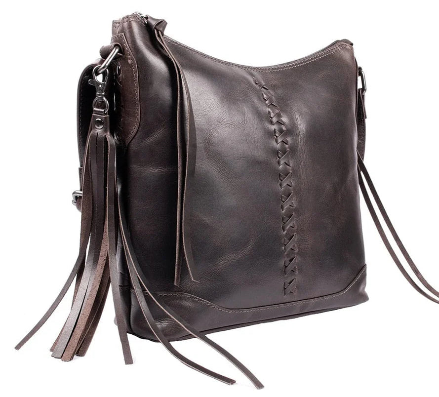 The Blake Scooped Leather Crossbody is crafted from premium full-grain leather, each piece showcasing its own natural variations in grain and shading. Intricate leather crisscross stitching adorns the front and sides, complemented by decorative long tassels for added charm. A large open pocket for your cell phone, and a leather key strap. A zippered pocket on the back adds more room for your essentials. Part of our Carry Conceal Handbags in our Smyrna, TN shop.