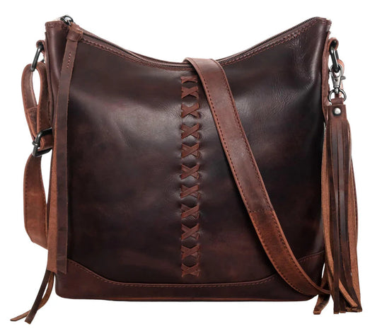 The Blake Scooped Leather Crossbody is crafted from premium full-grain leather, each piece showcasing its own natural variations in grain and shading. Intricate leather crisscross stitching adorns the front and sides, complemented by decorative long tassels for added charm. A large open pocket for your cell phone, and a leather key strap. A zippered pocket on the back adds more room for your essentials. Part of our Carry Conceal Handbags in our Smyrna, TN shop.