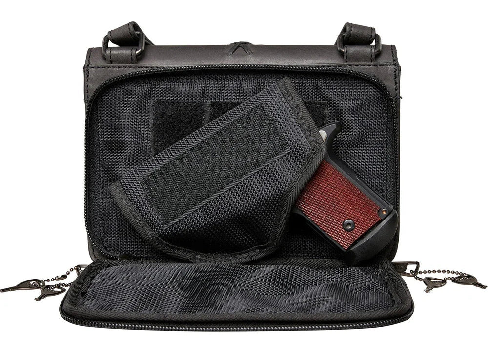 The Jolene, crafted with premium buffalo leather, has a flap that is highlighted with stunning criss-cross lacing. Underneath the front flap, secured with strong snaps, is an organizer with an ID holder, 3 credit card slots, an open pocket for a cell phone, and two zippered coin pockets with RFID protection. The main interior has two open compartments divided by a zippered pocket with an additional zippered pocket on the back of the interior. The adjustable crossbody strap measures 29”- 54” by .75 wide 