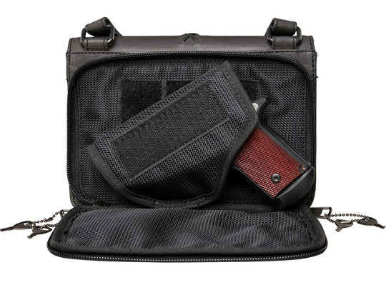 The Jolene, crafted with premium buffalo leather, has a flap that is highlighted with stunning criss-cross lacing. Underneath the front flap, secured with strong snaps, is an organizer with an ID holder, 3 credit card slots, an open pocket for a cell phone, and two zippered coin pockets with RFID protection. The main interior has two open compartments divided by a zippered pocket with an additional zippered pocket on the back of the interior. The adjustable crossbody strap measures 29”- 54” by .75 wide 