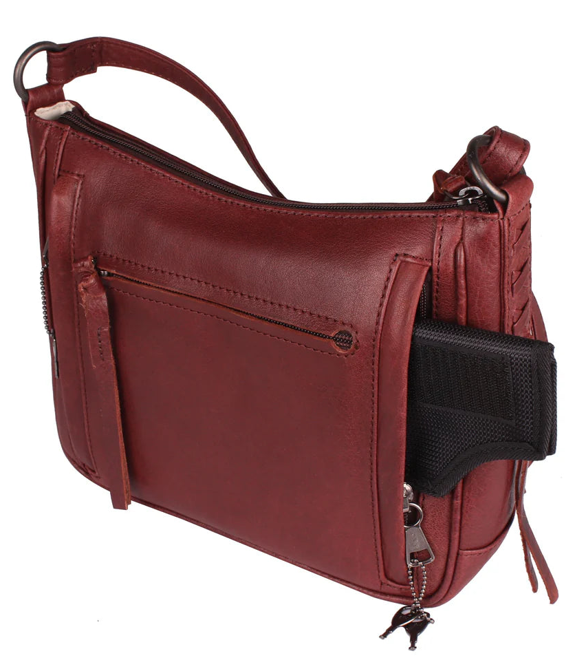 The Callie Leather Crossbody is crafted with quality full-grain leather, featuring stylish lacing on the front pocket and ends. The interior features a zippered pocket, 2 open slip pockets, another large open pocket, and a key strap for fast access to your keys. An additional zippered pocket on the back adds more room for your cell phone or other essentials. The ideal size for the lady on the go. Part of our Cary Conceal Handbags at our Smyrna, TN shop.