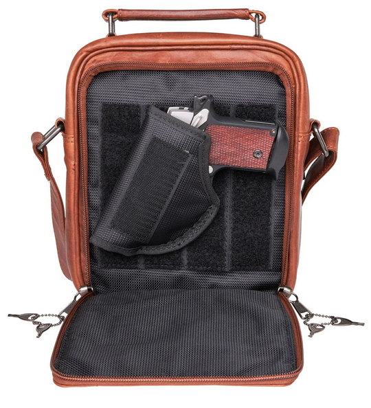 The Logan unisex crossbody is constructed with rich, full-grain leather. This bag is compact yet has plenty of storage space for your all necessities. The front compartment features an RFID-protected organizer with 4 credit card slots, 2 pen sleeves, and a zippered pocket on the front. The interior features a zippered pocket, a key strap, and 3 elastic magazine slots. Part of our Carry Conceal Handbags at our Smyrna, TN shop.