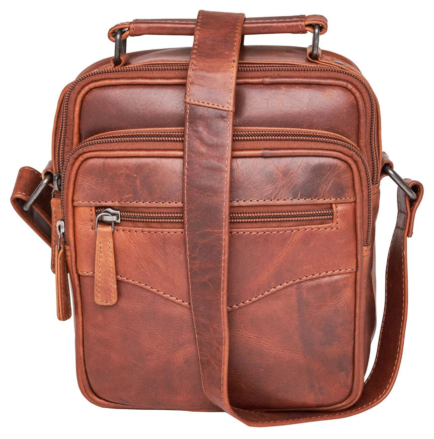 The Logan unisex crossbody is constructed with rich, full-grain leather. This bag is compact yet has plenty of storage space for your all necessities. The front compartment features an RFID-protected organizer with 4 credit card slots, 2 pen sleeves, and a zippered pocket on the front. The interior features a zippered pocket, a key strap, and 3 elastic magazine slots. Part of our Carry Conceal Handbags at our Smyrna, TN shop.