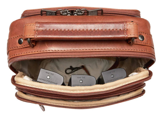 The Logan unisex crossbody is constructed with rich, full-grain leather. This bag is compact yet has plenty of storage space for your all necessities. The front compartment features an RFID-protected organizer with 4 credit card slots, 2 pen sleeves, and a zippered pocket on the front. The interior features a zippered pocket, a key strap, and 3 elastic magazine slots. Part of our Carry Conceal Handbags at our Smyrna, TN shop.
