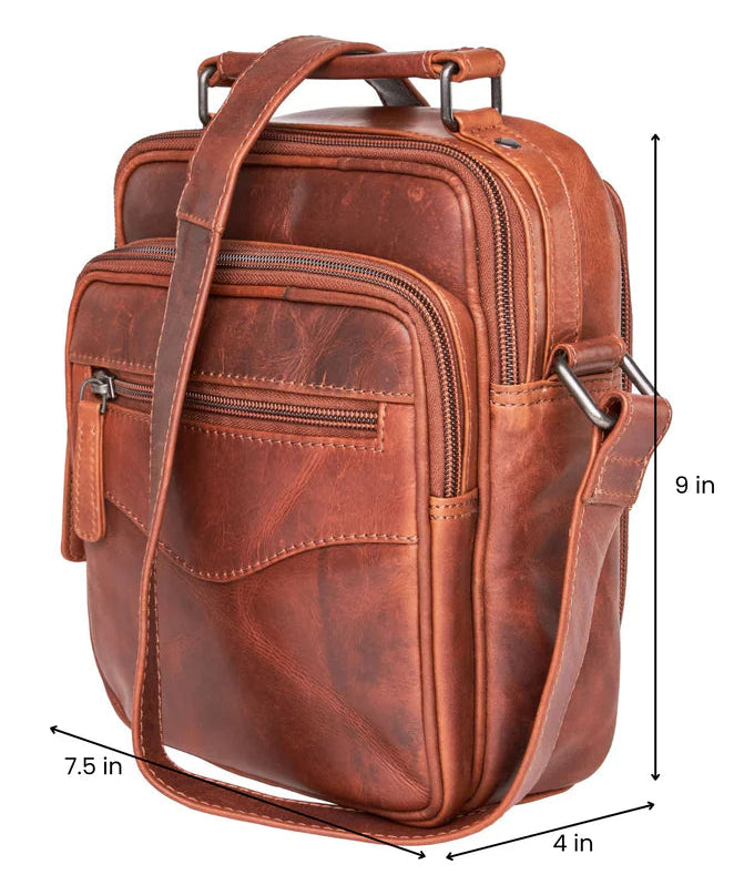 The Logan unisex crossbody is constructed with rich, full-grain leather. This bag is compact yet has plenty of storage space for your all necessities. The front compartment features an RFID-protected organizer with 4 credit card slots, 2 pen sleeves, and a zippered pocket on the front. The interior features a zippered pocket, a key strap, and 3 elastic magazine slots. Part of our Carry Conceal Handbags at our Smyrna, TN shop.