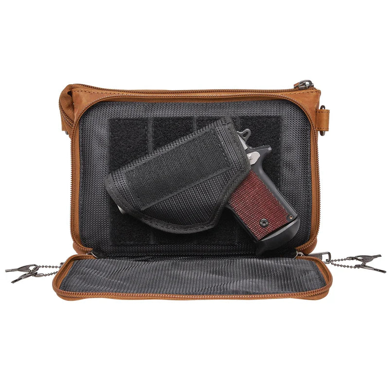 The Natasha Crossbody purse is available at our Smyrna, TN shop. Features full-grain leather front flap pocket, RFID-protected, includes an organizer with 4 credit card slots and a magnetic snap closure. Behind it is an open pocket with a magnetic snap closure, ideal for your cell phone. The main interior is divided into 2 parts and features a zippered pocket, an open slip pocket, and a leather key strap. The bag comes with two crossbody straps: one leather strap and a nylon camouflage strap.