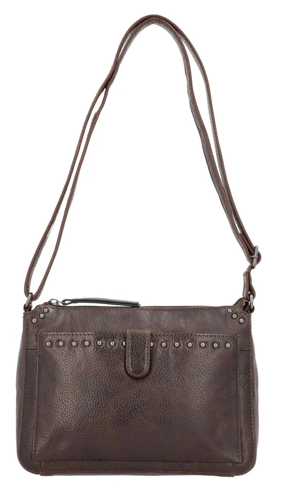 The Leah Crossbody is crafted with buffalo leather and has a light sprinkling of gunmetal studs. The front pocket is secured with a snap closure, contains a slim wallet. This RFID-protected wallet features 2 ID holders, 10 credit card slots, 2 open slit pockets for bills, and a full-size zippered pocket, ensuring your essentials are both organized and secure. The main interior is divided into two sections by a full-length zippered pocket. The front compartment offers two open slip pockets, while the back po