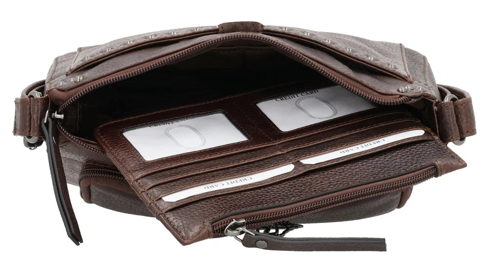 The Leah Crossbody is crafted with buffalo leather and has a light sprinkling of gunmetal studs. The front pocket is secured with a snap closure, contains a slim wallet. This RFID-protected wallet features 2 ID holders, 10 credit card slots, 2 open slit pockets for bills, and a full-size zippered pocket, ensuring your essentials are both organized and secure. The main interior is divided into two sections by a full-length zippered pocket. The front compartment offers two open slip pockets, while the back po