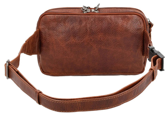 The Laney Belt Bag, crafted from buffalo leather, showcases a decorative scalloped design. This versatile accessory can be worn around the waist or as a sling, combining style and convenience. The bag is thoughtfully divided into three sections with a main interior, located in the middle compartment, secured with a leather strap with a magnetic snap closure. The concealed carry compartment is discreetly located in the back. Part of our Carry Conceal Handbags at our Smyrna, TN shop.