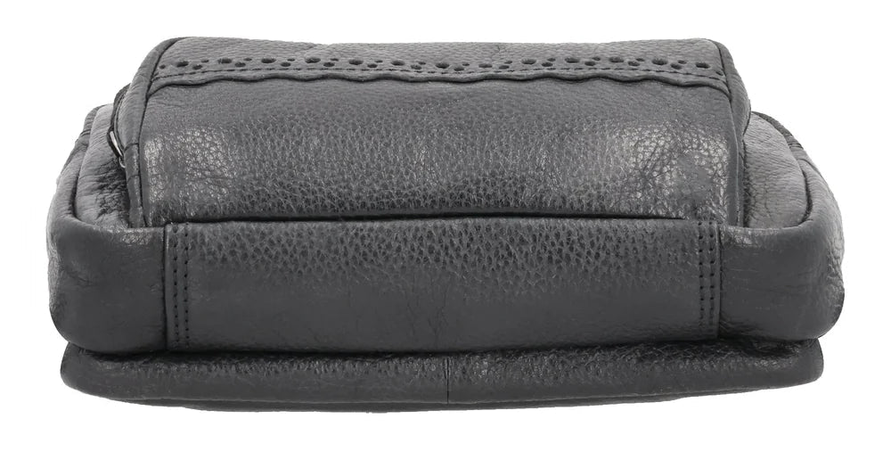 The Laney Belt Bag, crafted from buffalo leather, showcases a decorative scalloped design. This versatile accessory can be worn around the waist or as a sling, combining style and convenience. The bag is thoughtfully divided into three sections with a main interior, located in the middle compartment, secured with a leather strap with a magnetic snap closure. The concealed carry compartment is discreetly located in the back. Part of our Carry Conceal Handbags at our Smyrna, TN shop.