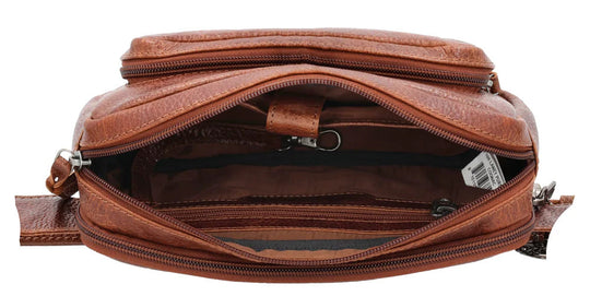 The Laney Belt Bag, crafted from buffalo leather, showcases a decorative scalloped design. This versatile accessory can be worn around the waist or as a sling, combining style and convenience. The bag is thoughtfully divided into three sections with a main interior, located in the middle compartment, secured with a leather strap with a magnetic snap closure. The concealed carry compartment is discreetly located in the back. Part of our Carry Conceal Handbags at our Smyrna, TN shop.