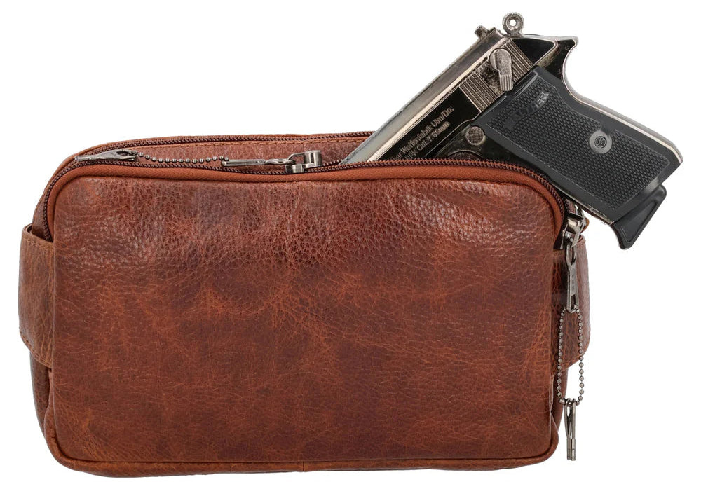 The Laney Belt Bag, crafted from buffalo leather, showcases a decorative scalloped design. This versatile accessory can be worn around the waist or as a sling, combining style and convenience. The bag is thoughtfully divided into three sections with a main interior, located in the middle compartment, secured with a leather strap with a magnetic snap closure. The concealed carry compartment is discreetly located in the back. Part of our Carry Conceal Handbags at our Smyrna, TN shop.