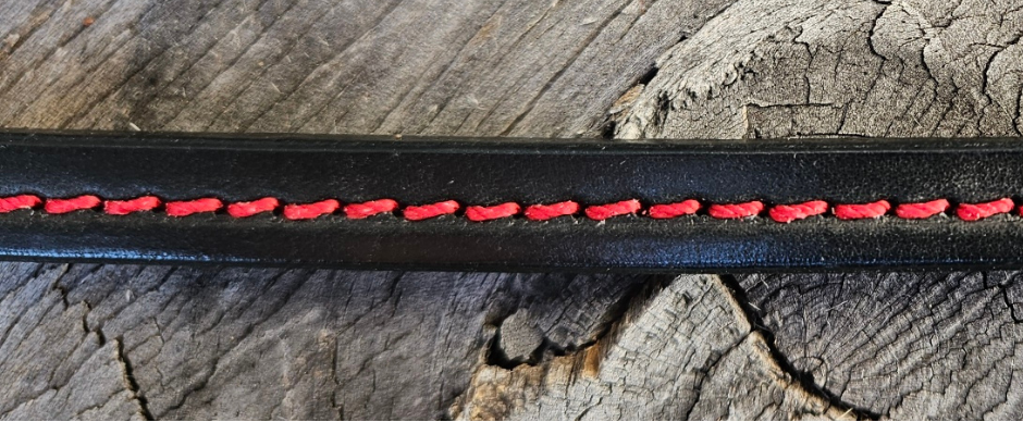 The Leather Wallet Strap... a alternative to the traditional chain. Made from thicker Bridle Leather with a Ring to attach your wallet and Fish Hook style jean clip. Stitched to elevate the coolness factor. This may look like a simple strap but it is Hand Burnished and assembled. Made at our Smyrna, TN shop not far crazy Broadway downtown Nashville. Wallet NOT included.

27" in total length
approx. 3/8" in width
Choose Black or Red stitching