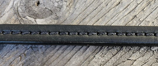 The Leather Wallet Strap... a alternative to the traditional chain. Made from thicker Bridle Leather with a Ring to attach your wallet and Fish Hook style jean clip. Stitched to elevate the coolness factor. This may look like a simple strap but it is Hand Burnished and assembled. Made at our Smyrna, TN shop not far crazy Broadway downtown Nashville. Wallet NOT included.

27" in total length
approx. 3/8" in width
Choose Black or Red stitching