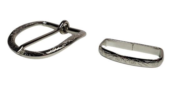 "Western up" your belt in a simple way with Buckle and Loop set. Stop in our shop in Smyrna, TN, just outside of Nashville to see a selection of what we call Basic buckles. This classic floral Nickel plated 2 pc set will do the job. Fits 1 1/2" belts.   Color - Antique Nickel