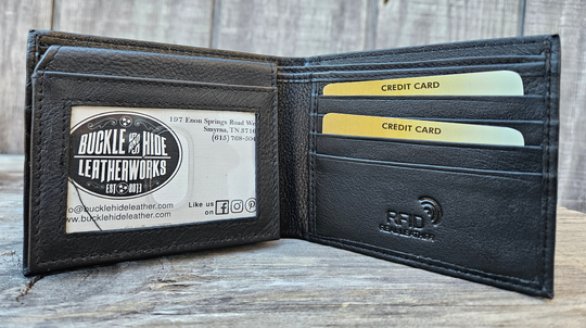 With a name like Lincoln this has to be a practical Bi-fold leather wallet. Equipped with 10 credit card slots and 2 ID window slots on a flip-up extension piece. The main compartments has a cash divider. Lined with RFID blocking. . Available in our Smyrna, TN shop near Sewarts Landing.

Made in India.
Approx. 4 1/4”x 3 3/4" when closed