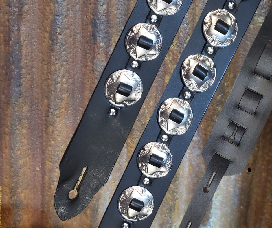 Conchos like Marshalls and Les Paul's have have been staple for years in Rock music!  "This 2" wide Guitar Strap is a nod to that classic influence. It's made from Pebbled Veg-Tan Cowhide and after some gig's it'll look like you bought in a Vintage shop. The classic adjustment style goes from approx. 42" to 56" at it's longest . Made just outside Nashville in our Smyrna, TN. shop. It will need a bit of time to "break in" but will get a great patina over time.  