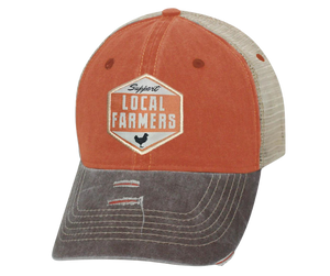 Local Farmers feed America, show your support with this Embroidered Distressed Trucker Cap! The faded orange twill front and tan mesh back feature  graphic of a Chicken, Support Local Farmers on a diamond shaped patch, and a brown bill and on the under side. Fits most anybody with a adjustable snap strap. Take a short trip outside Nashville to our Smyrna, TN shop and get yours now!  COLOR: BROWN/TAN/ORANGE