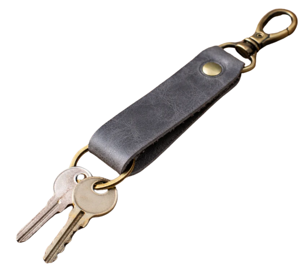 Keep your keys organized in style with the Loop genuine leather keychain. Made from high-quality Crazy Horse solid leather construction is reinforced with a secure metal button joint, ensuring strength you can rely on every day. Over time, the leather develops a beautiful patina, making each piece truly one of a kind. Now available at our Smyrna, TN shop not far from Franklin.

Dimensions: 6 × 0.85 inches