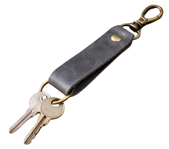 Keep your keys organized in style with the Loop genuine leather keychain. Made from high-quality Crazy Horse solid leather construction is reinforced with a secure metal button joint, ensuring strength you can rely on every day. Over time, the leather develops a beautiful patina, making each piece truly one of a kind. Now available at our Smyrna, TN shop not far from Franklin.

Dimensions: 6 × 0.85 inches
